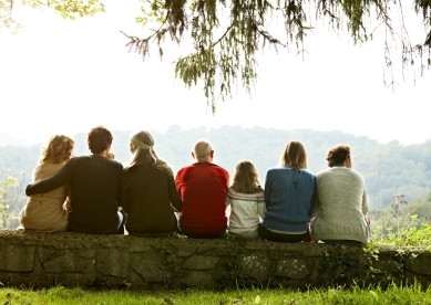 Multigeneration family on retaining wall